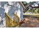 Exterior shot showing new backyard steps, door, and trees at 6949 2Nd St, Mulberry, FL 33860