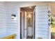 Newly remodeled bathroom featuring modern fixtures and a sleek vanity, visible from the home's entry at 6949 2Nd St, Mulberry, FL 33860