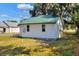 Exterior view of home featuring green metal roof at 6949 2Nd St, Mulberry, FL 33860