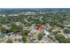 Aerial view showcases a charming neighborhood nestled among mature trees, highlighting the property's location at 707 Laurel Pointe Ct, Lakeland, FL 33813