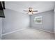 Bedroom featuring a ceiling fan, carpeted floors, and one window at 707 Laurel Pointe Ct, Lakeland, FL 33813