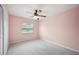 Bedroom featuring a ceiling fan, carpeted floors, and one window at 707 Laurel Pointe Ct, Lakeland, FL 33813