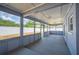 Enclosed, airy screened patio with views of a large yard, perfect for relaxing and entertaining outdoors at 707 Laurel Pointe Ct, Lakeland, FL 33813