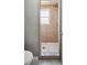 Walk-in shower with tile surround and built in window, complemented by a neutral color scheme at 707 Laurel Pointe Ct, Lakeland, FL 33813