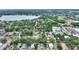Aerial view of a neighborhood with mature trees and small lakes in the distance at 716 S Franklin Pl, Lakeland, FL 33815