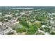A neighborhood with a small pond and mature trees provides a peaceful backdrop at 716 S Franklin Pl, Lakeland, FL 33815