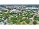 An aerial view of mature trees, industrial buildings, and commercial real estate nearby at 716 S Franklin Pl, Lakeland, FL 33815