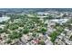 An aerial view of a neighborhood with mature trees and several small ponds at 716 S Franklin Pl, Lakeland, FL 33815