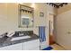 Bright bathroom with granite countertop, tiled walls and floors, and a vanity at 716 S Franklin Pl, Lakeland, FL 33815
