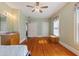 Spacious bedroom featuring hardwood floors, a large closet, and a vintage vanity at 716 S Franklin Pl, Lakeland, FL 33815