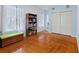 Bright bedroom featuring hardwood floors, natural light, and closet at 716 S Franklin Pl, Lakeland, FL 33815
