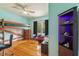 Bedroom featuring a unique bunk bed, hardwood floors, and a modern display shelf at 716 S Franklin Pl, Lakeland, FL 33815