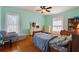 This cozy bedroom offers wood floors, fresh paint, natural light and ample space to relax at 716 S Franklin Pl, Lakeland, FL 33815