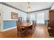 Traditional dining room with hardwood floors, decorative wallpaper, and a chandelier, ideal for entertaining at 716 S Franklin Pl, Lakeland, FL 33815
