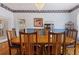 Formal dining room boasts hardwood floors, classic decor, and ample seating for large gatherings at 716 S Franklin Pl, Lakeland, FL 33815