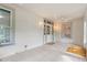 Enclosed porch featuring tile floors, multiple windows and white beadboard at 716 S Franklin Pl, Lakeland, FL 33815