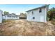 Spacious backyard featuring a guest house and a detached garage at 717 Frank Lloyd Wright Way, Lakeland, FL 33803