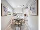 Cozy dining area featuring a round table, stylish chairs, and modern decor at 717 Frank Lloyd Wright Way, Lakeland, FL 33803