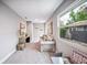 Versatile living room area is filled with natural light, showcasing its comfort and view at 717 Frank Lloyd Wright Way, Lakeland, FL 33803