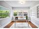 Sunlit office with built-in bookshelves and decorative ceiling at 717 Frank Lloyd Wright Way, Lakeland, FL 33803