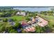 Charming condo community with red tile roofs near a picturesque lake, offering a serene and appealing living environment at 733 Carpenters Way # 36, Lakeland, FL 33809