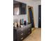 Bedroom dresser with mirror and decorative items adding a touch of elegance to the living space at 733 Carpenters Way # 36, Lakeland, FL 33809