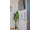 Corner of bedroom featuring a television, large plant and wall decor at 733 Carpenters Way # 36, Lakeland, FL 33809