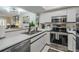 Well-equipped kitchen with stainless steel appliances, white cabinets, and sleek countertops at 733 Carpenters Way # 36, Lakeland, FL 33809