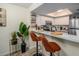 Bright kitchen with white cabinets, stainless steel appliances, and bar seating at 733 Carpenters Way # 36, Lakeland, FL 33809