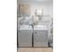 Laundry room featuring a washer, dryer, and shelving for storage at 733 Carpenters Way # 36, Lakeland, FL 33809