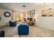 Chic living room with tile flooring, stylish furniture, and access to a screened-in patio with outdoor views at 733 Carpenters Way # 36, Lakeland, FL 33809