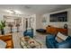 Cozy living room featuring comfortable seating, sleek furniture, and modern tiled floors at 733 Carpenters Way # 36, Lakeland, FL 33809