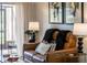 Comfortable leather recliner with stylish accents, paired with modern artwork and abundant natural light at 733 Carpenters Way # 36, Lakeland, FL 33809