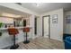 Open-concept living area with bar seating and a view of the adjacent kitchen and bathroom at 733 Carpenters Way # 36, Lakeland, FL 33809