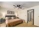 Comfortable bedroom featuring a cozy bed, neutral walls, and framed art for a relaxing retreat space at 733 Carpenters Way # 36, Lakeland, FL 33809