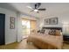 Inviting main bedroom with access to balcony, neutral tones, plush bedding, and stylish decor for serene retreat at 733 Carpenters Way # 36, Lakeland, FL 33809