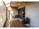 Relaxing sunroom with tiled floors, ceiling fan, and sliding glass doors to extend the living space at 733 Carpenters Way # 36, Lakeland, FL 33809