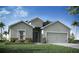 Charming single-Gathering home with a gray exterior, landscaped front yard, and attached two-car garage at 7562 Sw 108Th St, Ocala, FL 24476