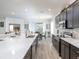 Open-concept kitchen featuring a spacious island, stainless steel appliances, and ample counter space at 7562 Sw 108Th St, Ocala, FL 24476