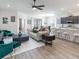Inviting living room with stylish decor, hardwood floors, and abundant natural light at 7562 Sw 108Th St, Ocala, FL 24476