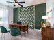 Home office featuring a statement wall, elegant desk, and comfortable seating, ideal for productivity at 7562 Sw 108Th St, Ocala, FL 24476