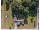 Bird's-eye view of the home and surrounding acreage with lush greenery and mature trees at 7721 Forest Way, Lakeland, FL 33810