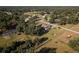 Scenic aerial shot showcasing the property's expansive lot and the tranquil neighborhood at 7721 Forest Way, Lakeland, FL 33810