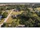 Aerial view of the property showcasing its location amidst lush trees and surrounding landscape at 7721 Forest Way, Lakeland, FL 33810