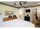Bedroom featuring wood-look floors, a ceiling fan, and plenty of room at 7721 Forest Way, Lakeland, FL 33810