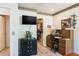 Bedroom area with desk, storage, and TV viewing area, and access to walk-in closet at 7721 Forest Way, Lakeland, FL 33810