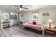Bedroom featuring a daybed, closet with laundry and neutral color palette at 7721 Forest Way, Lakeland, FL 33810