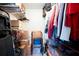 Walk-in closet filled with boxes and clothes, offering ample storage solutions at 7721 Forest Way, Lakeland, FL 33810
