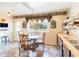 Bright dining area with glass table set offers outdoor views at 7721 Forest Way, Lakeland, FL 33810