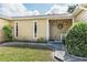 Inviting front entrance with a well-maintained lawn, shrubs, and tasteful exterior decor at 7721 Forest Way, Lakeland, FL 33810